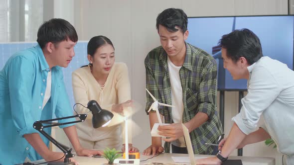 Asian Man And Woman In Engineering Group Arguing During Testing The Wind Turbine At The Office