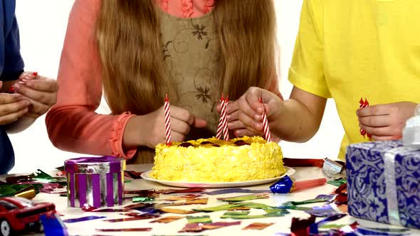 Children's Hands Turn Put Their Candles in the Cake, Dressed Bright Things