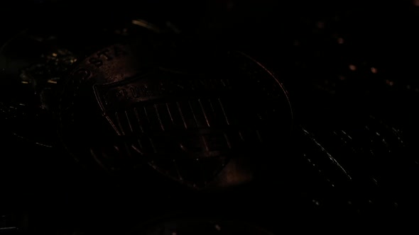 Coins in a Dark Room. Close Up