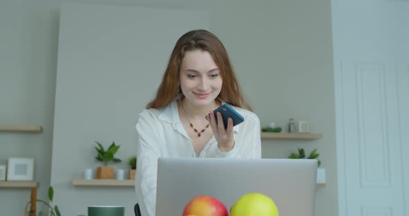 Closeup Smiling Business Woman Talking Mobile Phone at Home Office. Portrait of Joyful Girl Making