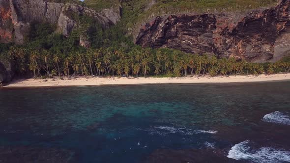 4k 24fps Paradise Beach With Palms And Mountains Inthe Back In The Caribbean