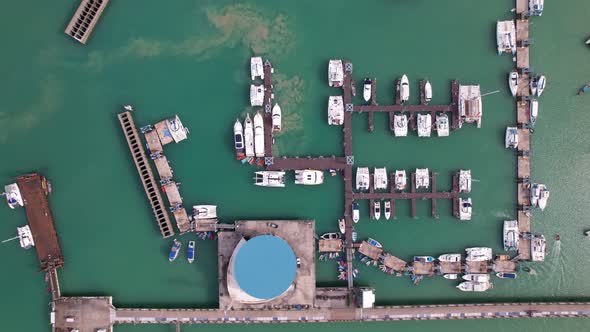Aerial View Top down Drone shot of Yacht and sailboat parking in marina Transportation and travel