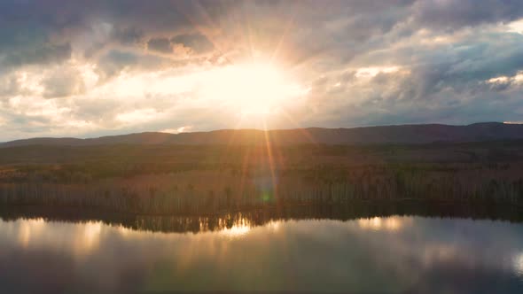 Aerial View of the Natural Landscape Forest on the Lake Shore at Sunset