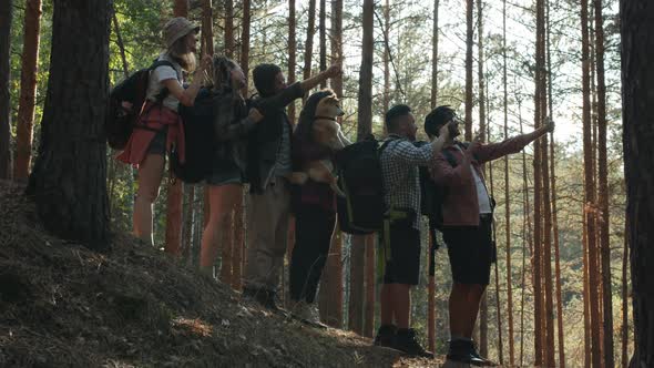 Portrait of Creative Young People Tourists Taking Selfie with Smart Phone Camera in Green Forest