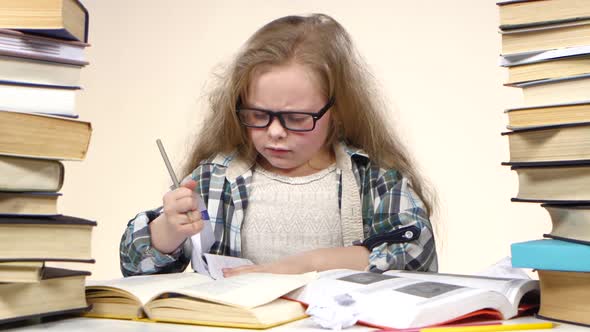 Little Girl Excitedly Pulls a Page From the Book Information. White Background