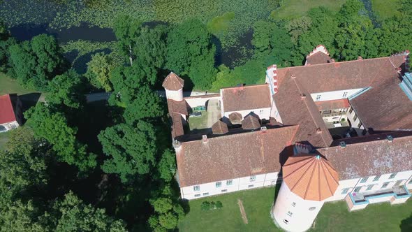 Edole Castle Manor and Old Village With Lake in Latvia, Aerial Shot.