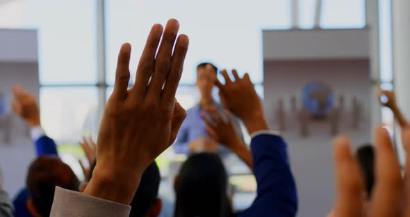 Business people raising their hands in the business seminar 4k