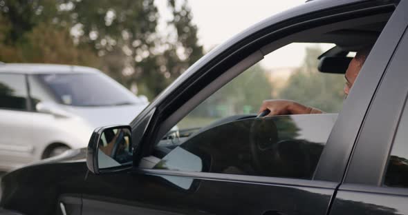 Young Black Driver Behind the Wheel of a Car