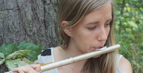 Girl Playing The Flute 2