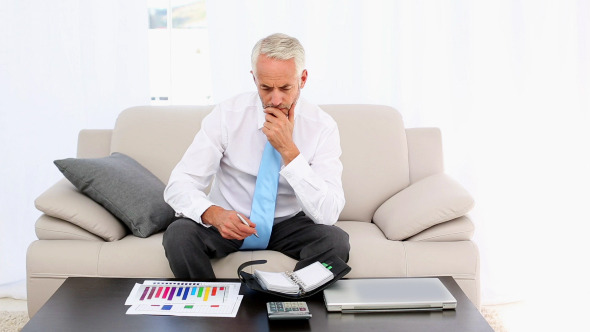 Businessman Writing In His Diary