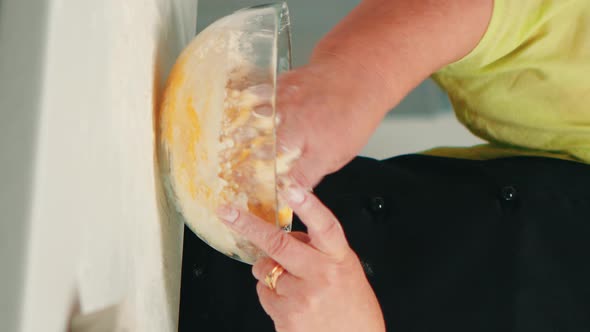Vertical Video: Chef Mixing Bread Ingredients
