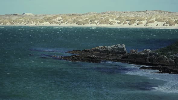 Turquoise Water and Rocky Cliffs in the Falkland Islands (Malvinas).