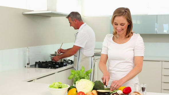 Mature Smiling Couple Making Healthy Dinner