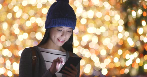 Woman look at mobile phone at outdoor