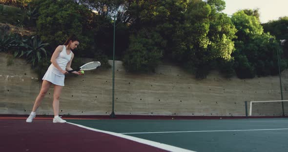 Woman playing tennis on a court