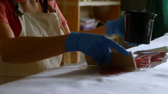 Woman making surfboard