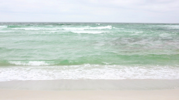 Retired Woman Walking By The Sea