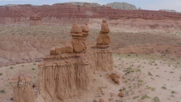 Aerial Drone Flight Around Stone Hoodoos Guarding the Valley of the Goblins State Park in Utah, USA