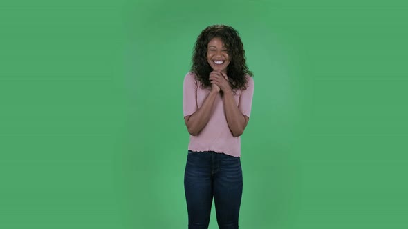 Portrait of Beautiful African American Young Woman Smiles with Happy Joy. Burning Brunette with Wavy