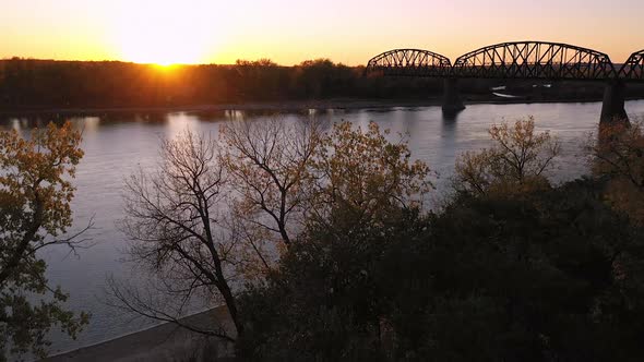 Rising aerial view along the Missouri river in North Dakota at sunset