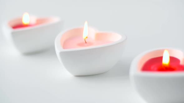 Heart Shaped Candles Burning in St Valentines Day