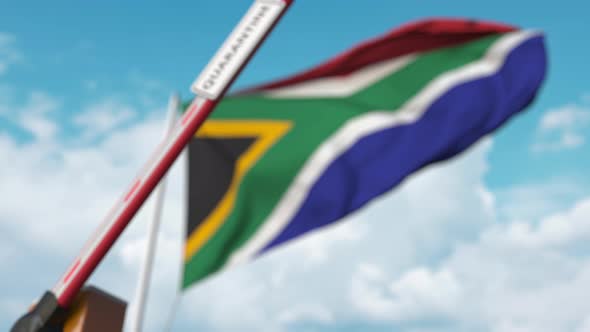 Barrier Gate with QUARANTINE Sign Being Closed at Flag of South Africa alt