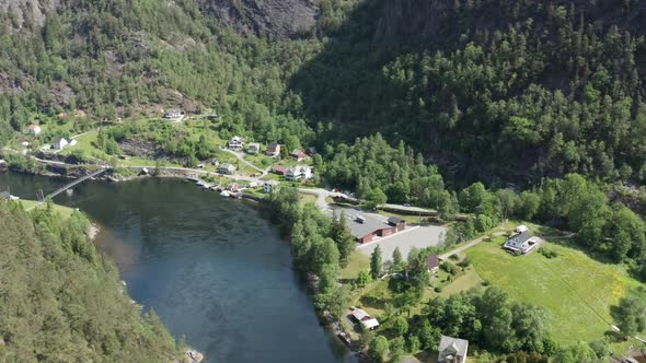 Vikafjord channel leading to river Vosso and school building along road FV569 - Voss salmon river Re