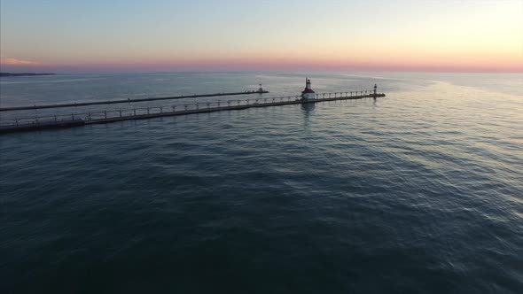 Aerial wide shot of St. Joseph lighthouse on Lake Michigan