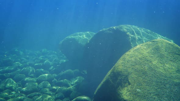 Rocks In Sun Rays Underwater