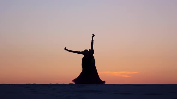 Graceful Movements of a Dancer, Dancing Belly Dance While on the Beach, Silhouettes