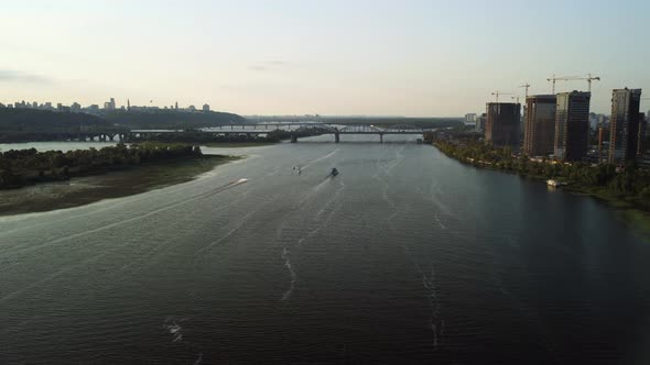 Aerial view of the modern sailboat sailing on the river