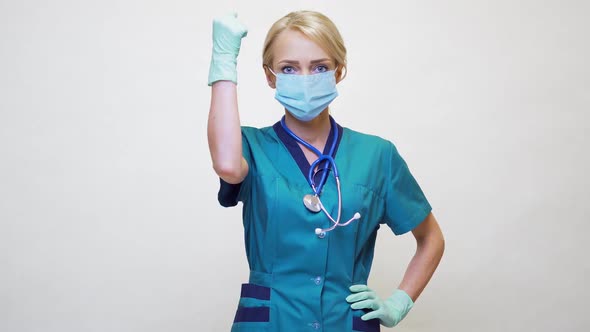 Medical Doctor Nurse Woman Wearing Protective Mask and Rubber or Latex Gloves - Yes Win Gesture