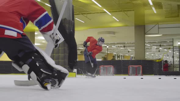 Female Hockey Forward Having Practice on Ice