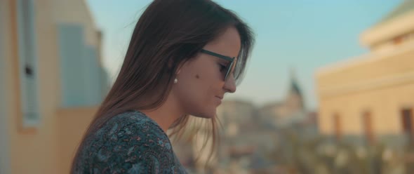 Woman looking down from balcony