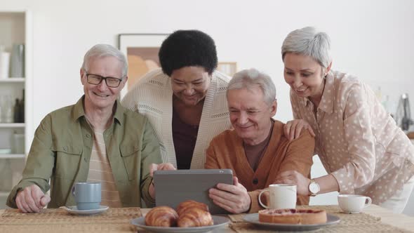 Diverse Seniors Using Tablet Computer