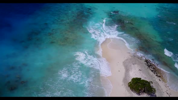 Aerial drone shot texture of perfect coastline beach vacation by blue sea and white sand background 