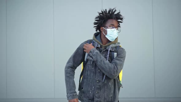 African American Man in Eyeglasses and Covid Face Mask Showing Thumb Up Looking at Camera