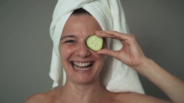 Happy mature woman having skin care spa day - People wellness lifestyle concept