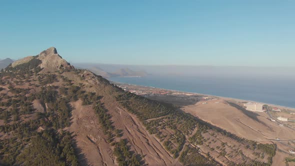 Aerial shot towards Atlantic seascape from Porto Santo volcanic peak