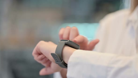 Side View of Female Hands Using Smartwatch