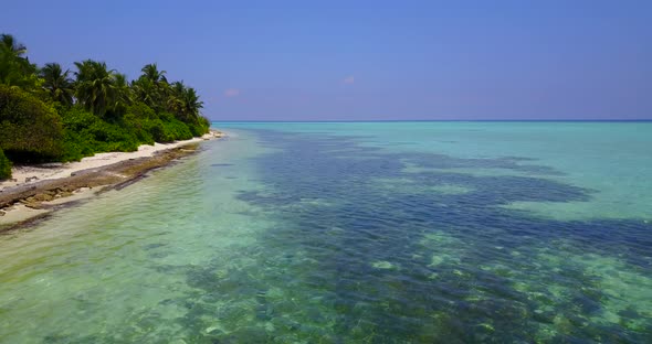 Natural overhead clean view of a sunshine white sandy paradise beach and aqua turquoise water backgr