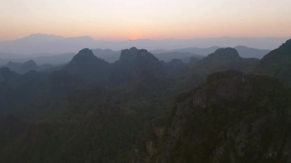 Aerial top view of forest trees and green mountain hills. Nature landscape background, Thailand.