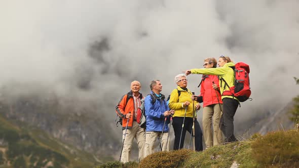 Seniors Hiking With Female Guide