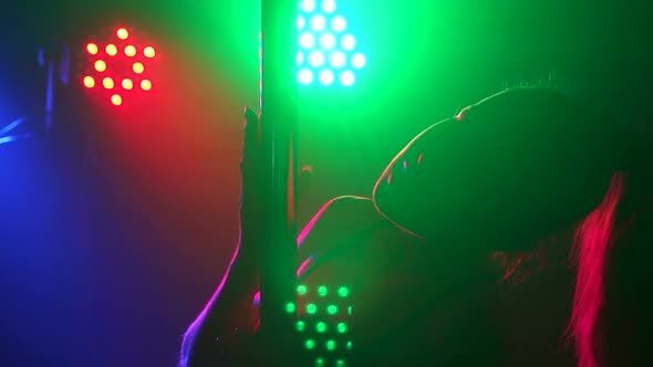 Silhouette of Girl Performing Erotic Dance on Pole