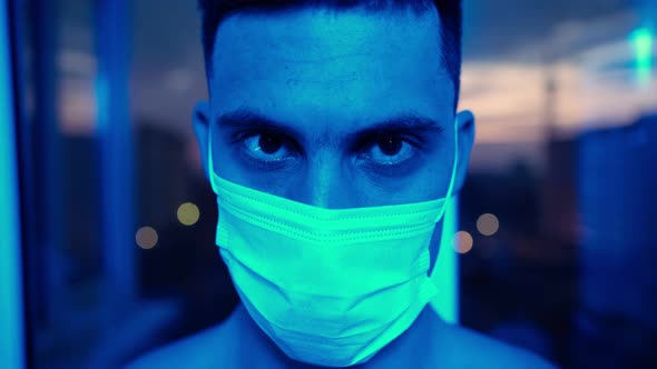 Man in Medical Mask Illuminated Ambulance Flashing Lights
