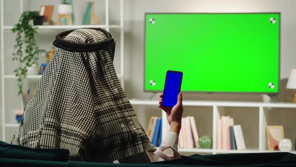 Middle Eastern Man Using Phone with Chroma Key Closeup