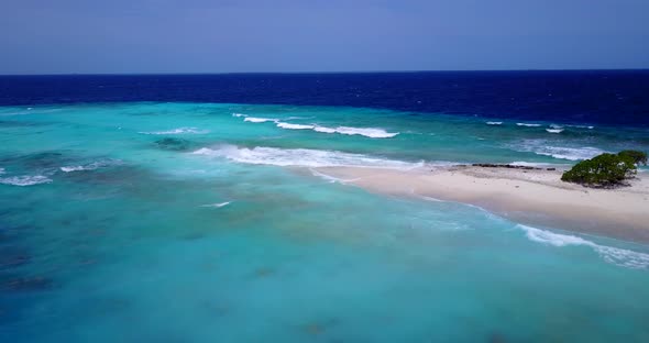 Tropical aerial abstract shot of a summer white paradise sand beach and aqua turquoise water backgro