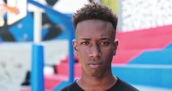 Young african man looking on camera outdoor