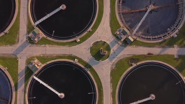 Sludge Scraper On Circular Tanks At Detroit Wastewater Treatment Plant In Michigan, USA. - aerial
