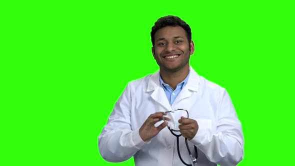 Young Darkskinned Doctor Puts on Stethoscope